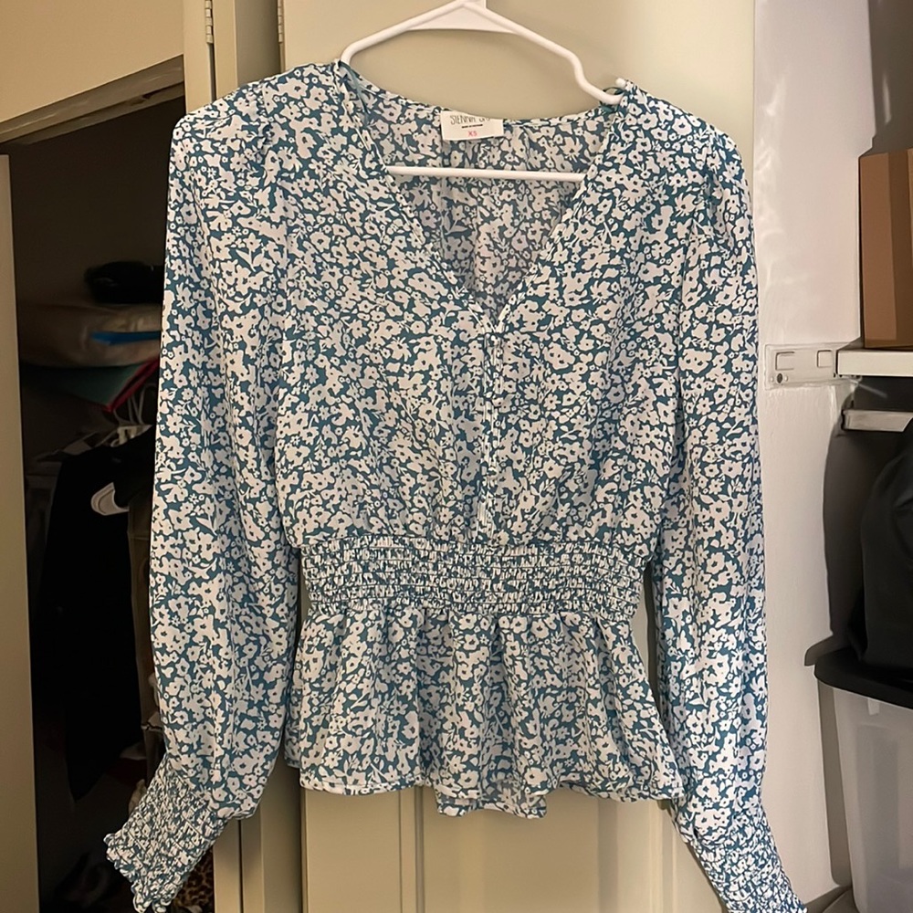 Flower print long sleeve shirt. Never worn tags still on